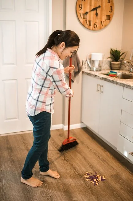 Cleaner cleaning the floor in a laboratory environment